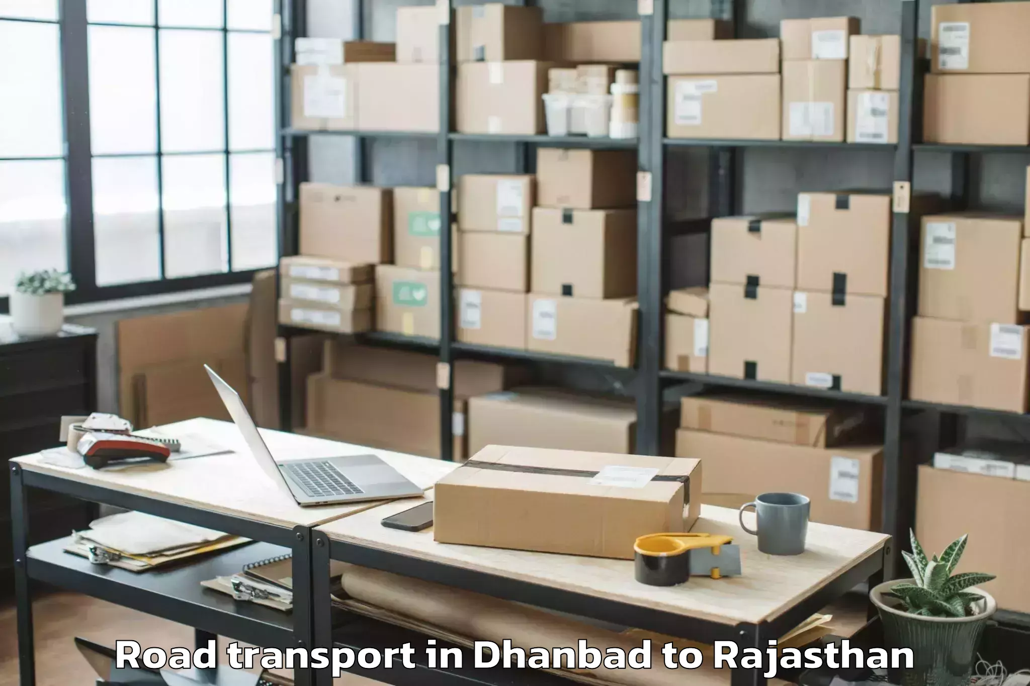 Book Dhanbad to Nadbai Road Transport Online